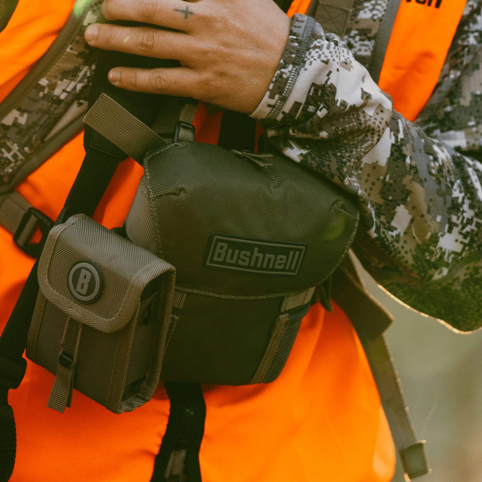 Men wearing Bushnell R3 Ranger Green Binoculars in the case on body