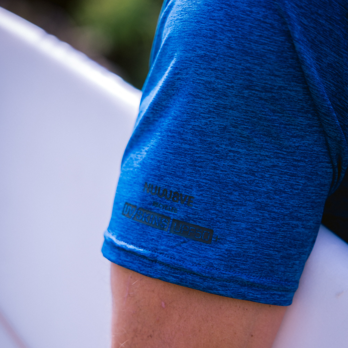 Close up of sleeve of C-Skins Men's NuWave UV UPF50 Short Sleeve Surf Tee Deep Blue C-NLYSURFM