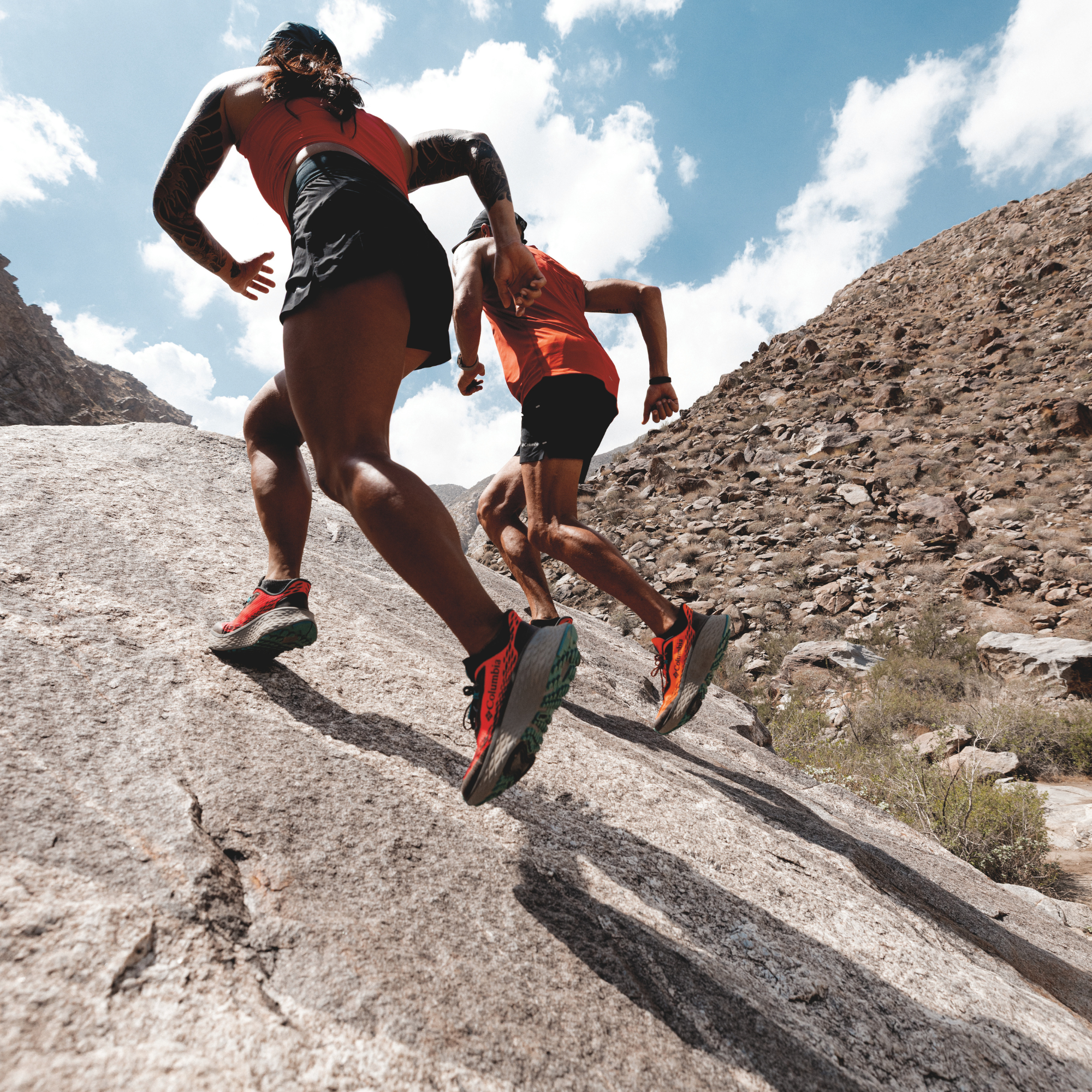 Woman trail running in Columbia Women's Konos Trillium ATR Trail Shoes Neon Sunrise Teal Chloride 648 2145291 on desert gravel surface
