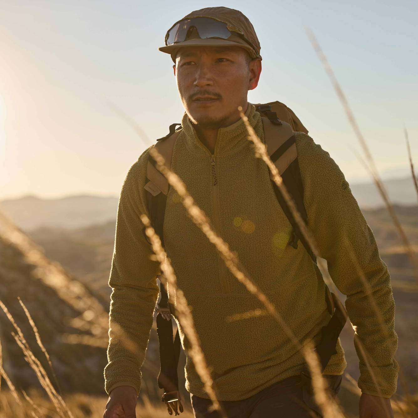 Man wearing Craghoppers Unisex Nosilife Desert III Sun Hat Pebble 695 CMC132 in the sun