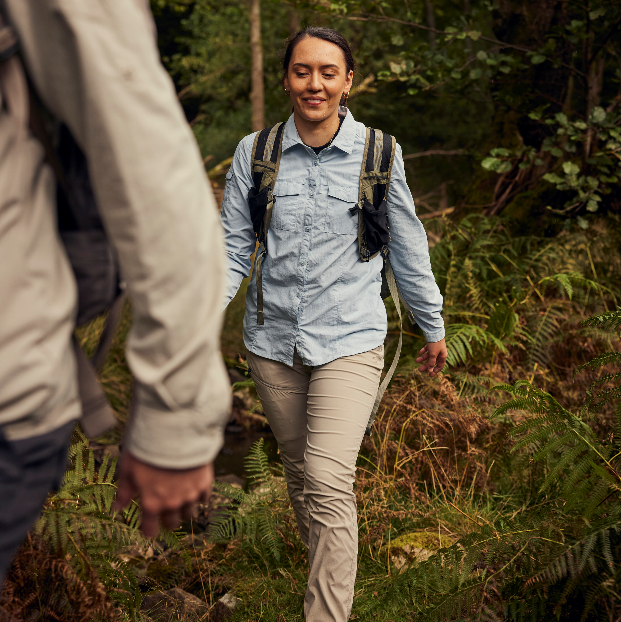 Woman hiking wearing Craghoppers Women's Nosilife Pro III Insect Repellent UPF50 Trousers Soft Mushroom KD7 CWJ1373
