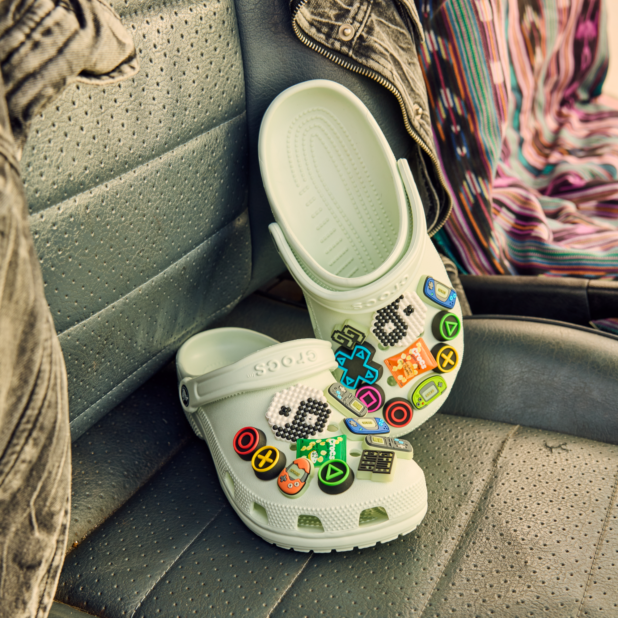 Crocs Unisex Classic Clogs Mint Tint 3YF 10001 sitting on a car seat