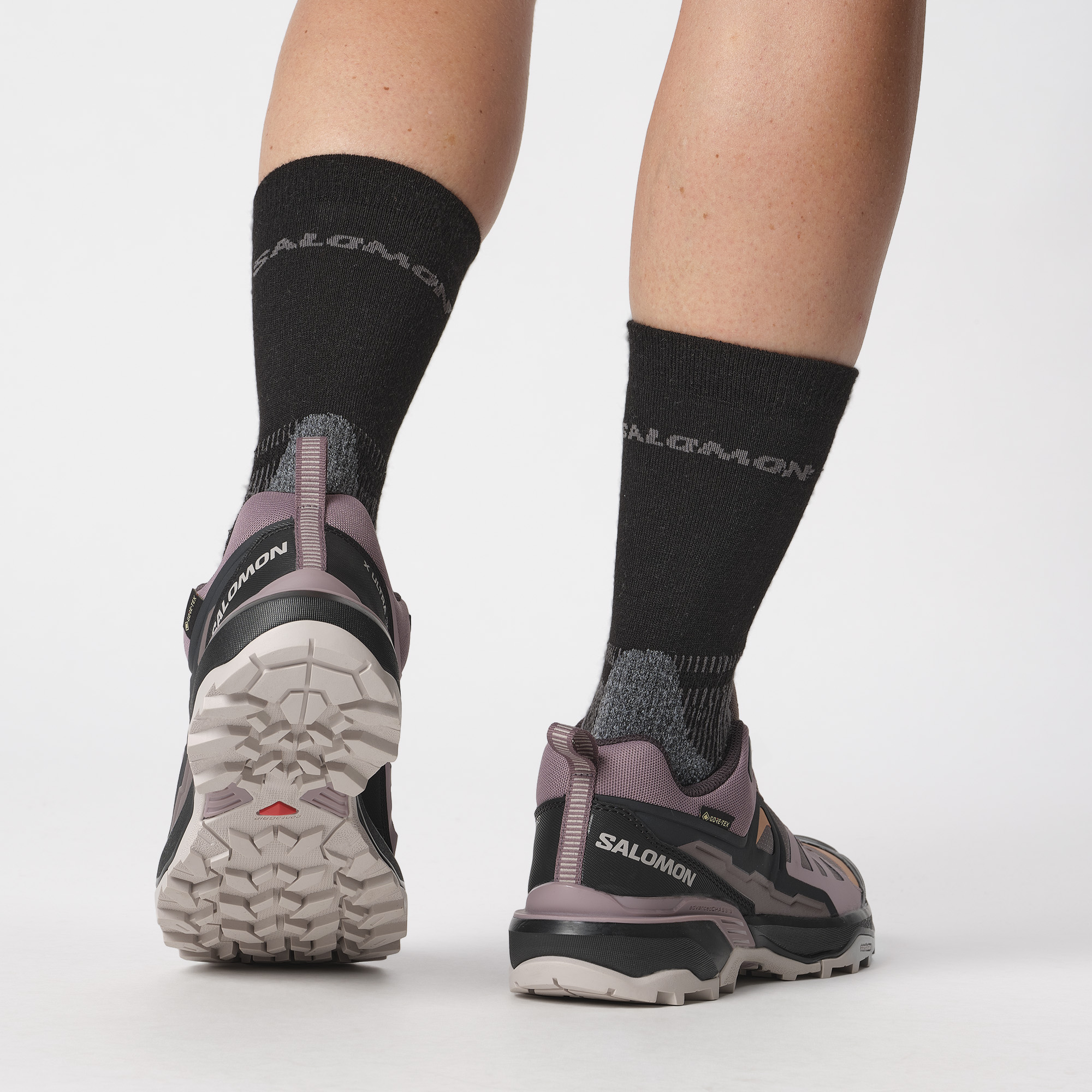 Rear view of woman wearing Salomon Women's X Ultra 360 Gore-Tex Hiking Trail Shoes Plum Kitten Phantom Cork L47449400