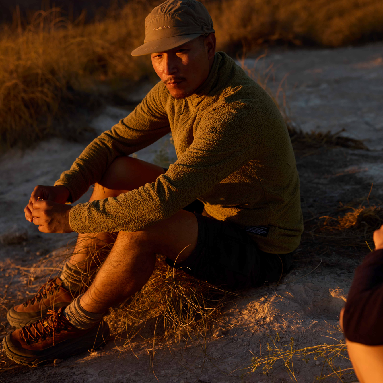 Man wearing Craghoppers Unisex Nosilife Desert III Sun Hat Pebble 695 CMC132 at dusk
