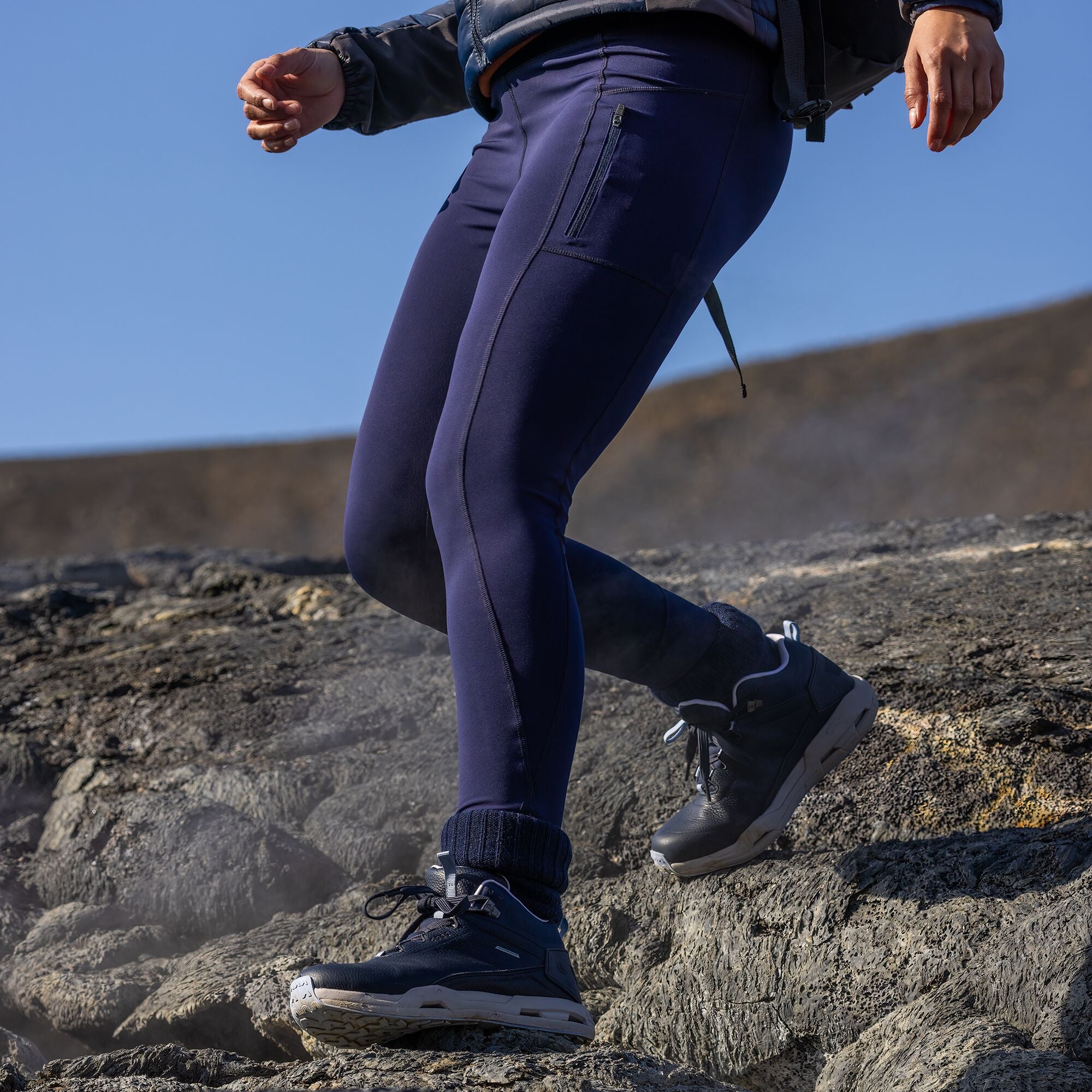 Woman hiking wearing Craghoppers Women's Kiwi Pro UPF50 Thermo Thermal Leggings Tights Blue Navy 7V1 CWJ1334 CWJ1335