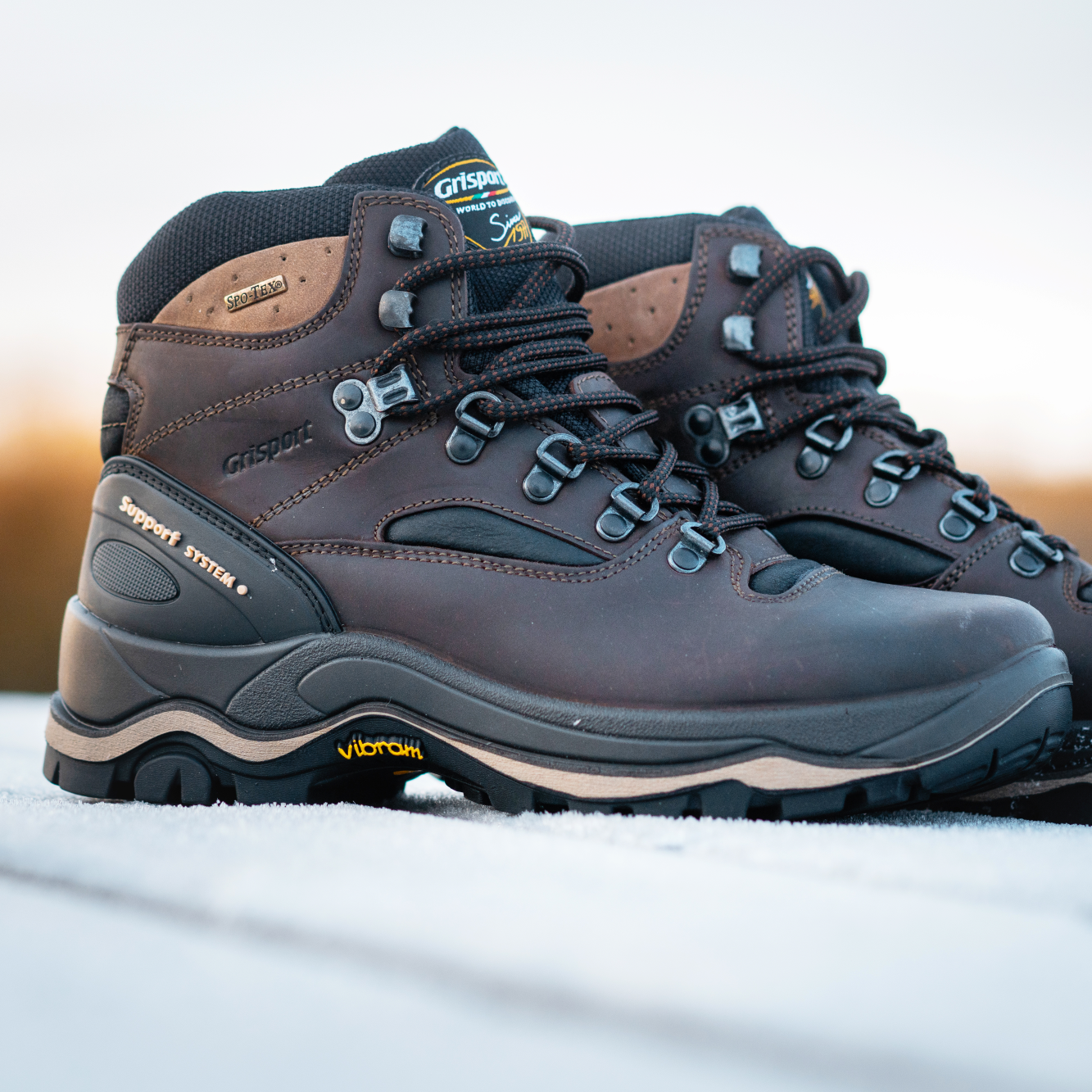 Grisport Men's Quatro Waterproof Hillwalking Boots Brown CMG614 sitting on a picnic table