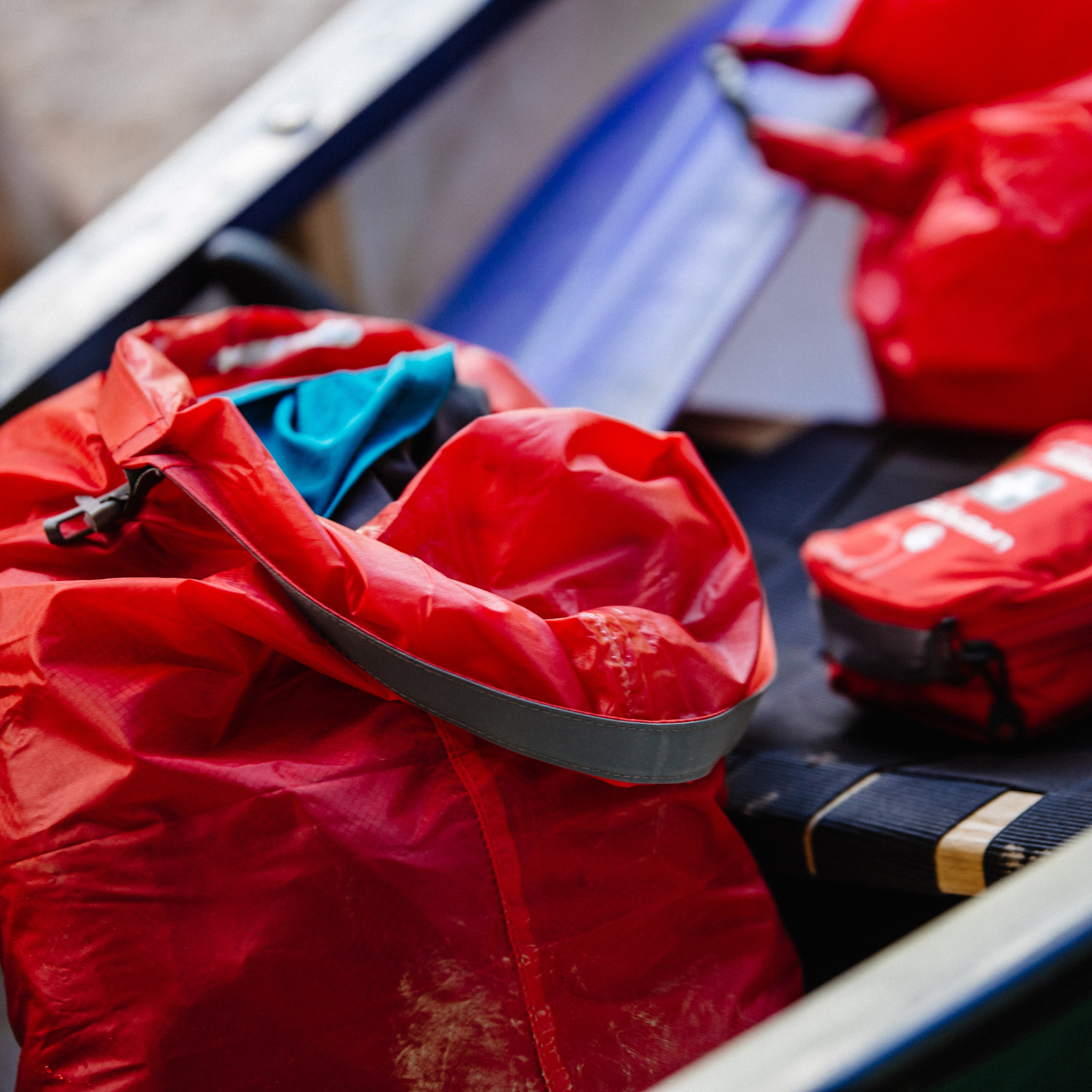 Lifeventure Ultralight Dry Bag open sitting next to a first aid kit