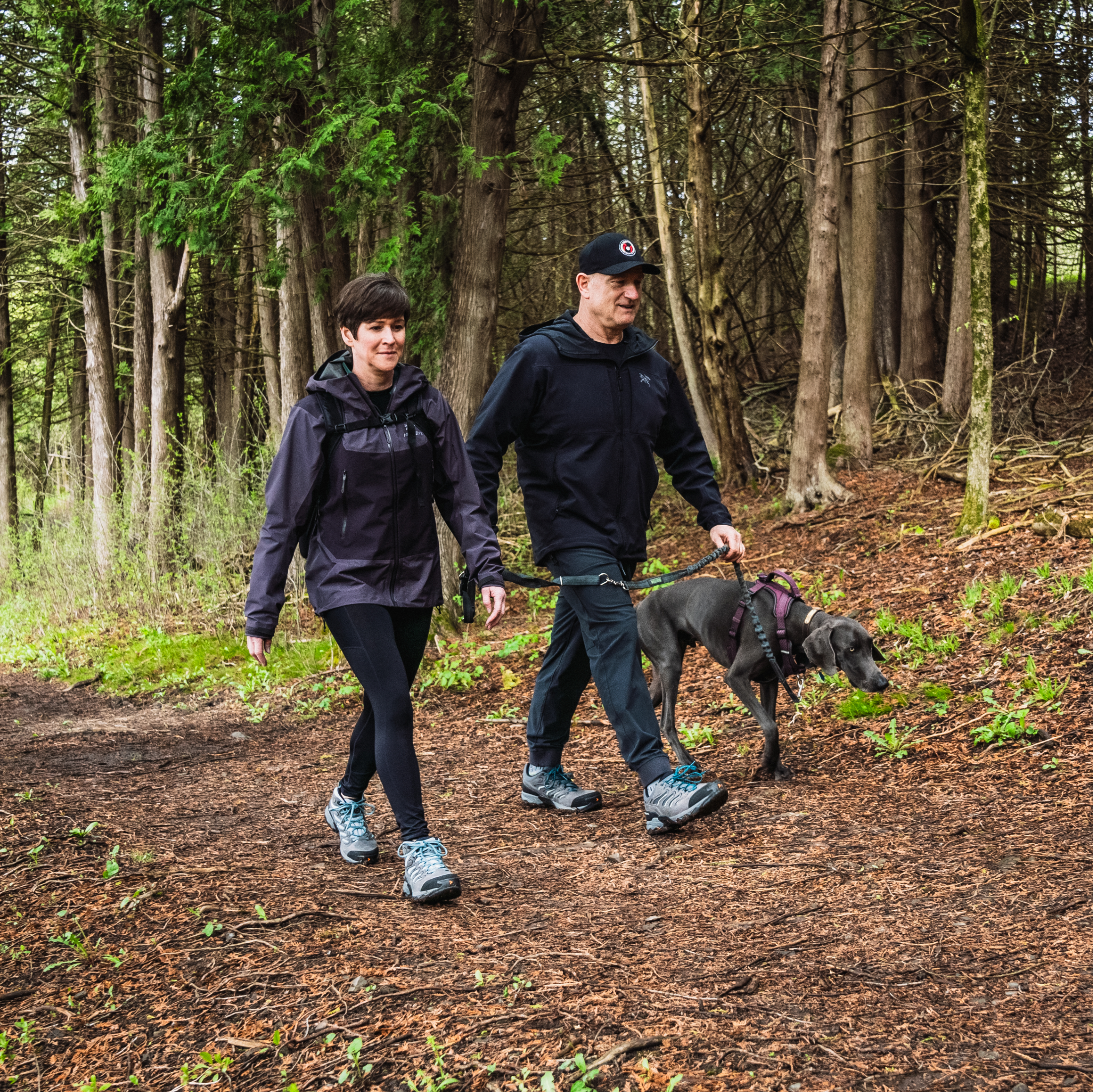 Man and woman wearing Person wearing Scarpa Moraine Gore-Tex Hillwalking Boots walking the dog in a forest