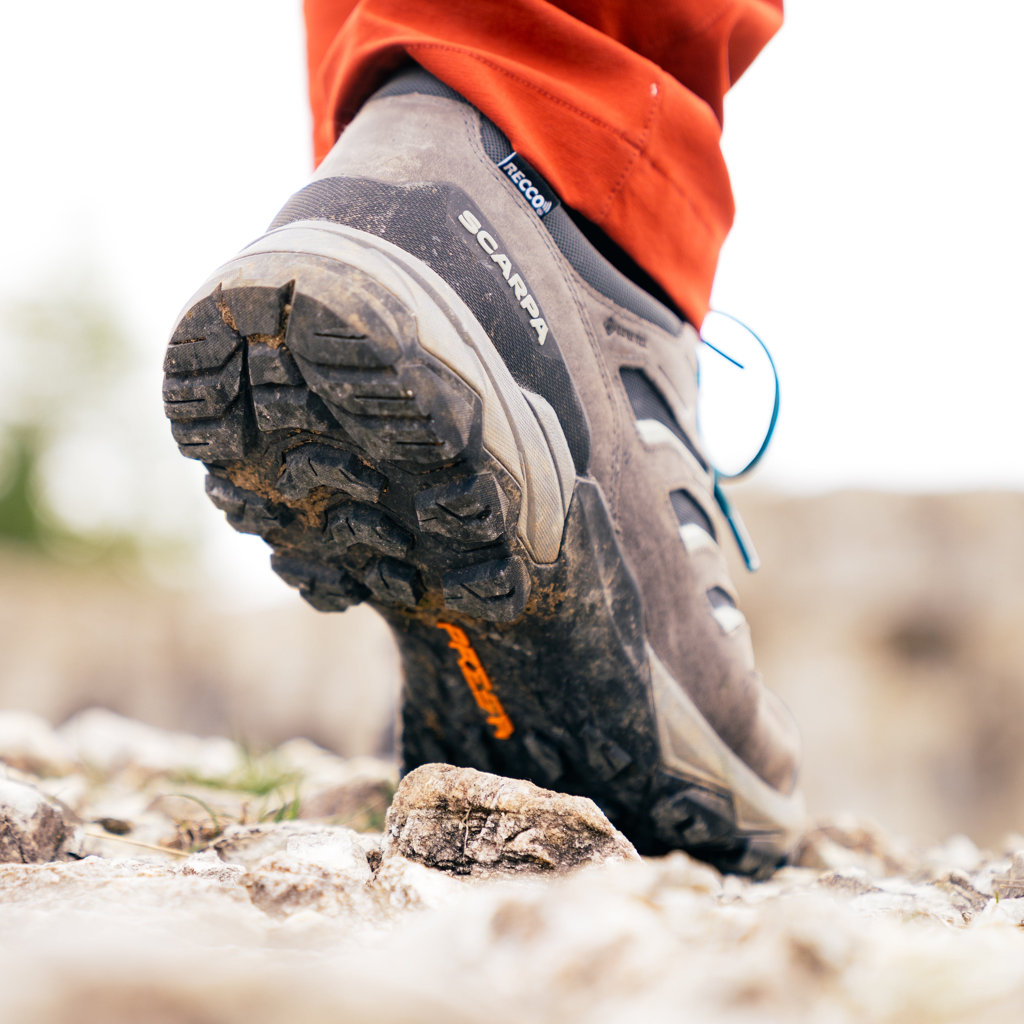 Person walking on gravel in Scarpa Men's Moraine Mid Gore-Tex Hillwalking Boots Anthracite 63056-201
