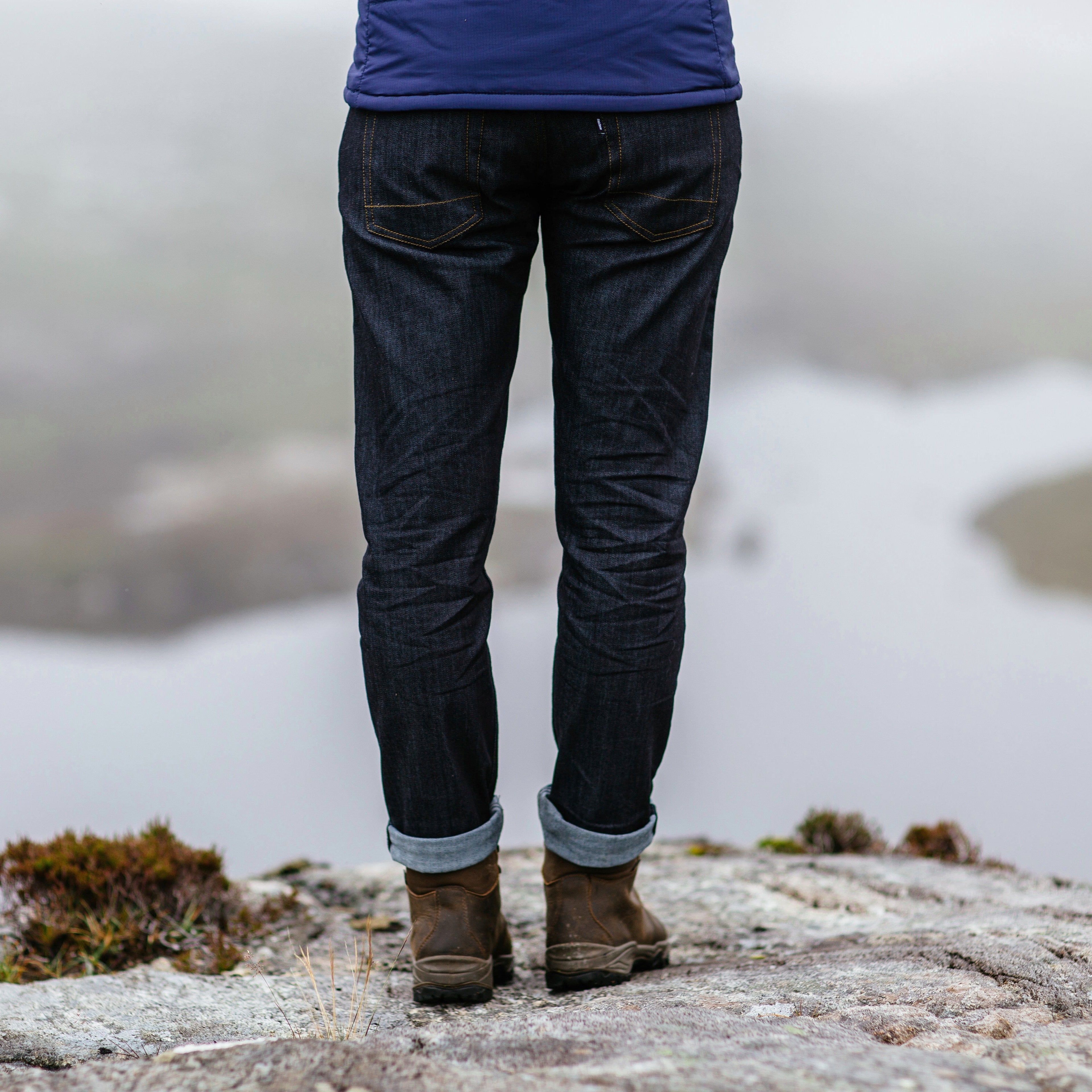 Woman wearing Scarpa Women's Terra Gore-Tex Hillwalking Hiking Boots Brown 30020-202N on a rocky outcrop looking over a lake