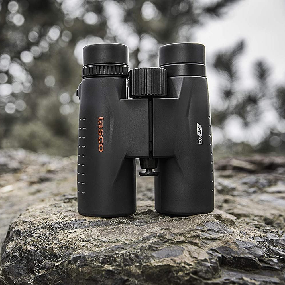 Tasco Essentials Binoculars Black 8x42 TAES8X42 sitting on rocky ground