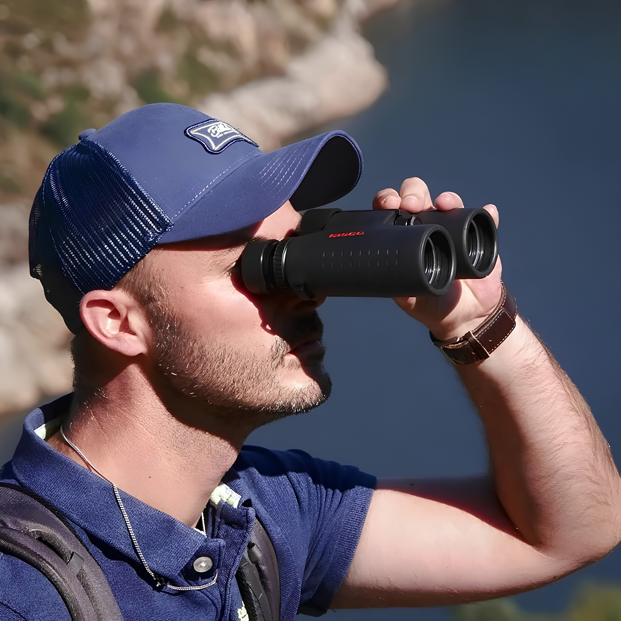 Man using Tasco Essentials Binoculars Black 10 x 42 TAES10X42