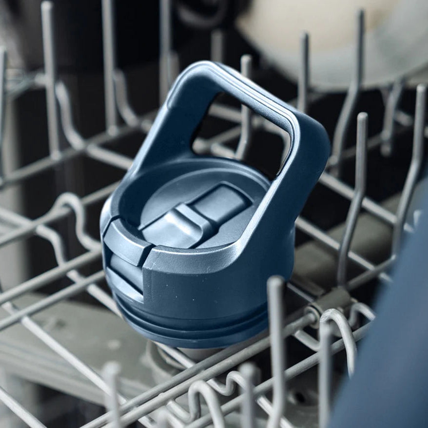 Navy Yeti colour straw bottle cap inside a dishwasher rack